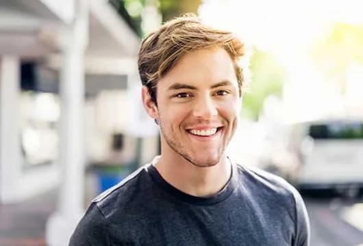 Man with black shirt smiling